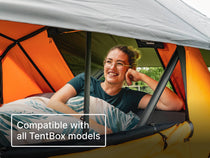 Person leaning against the BackRest inside a TentBox with text 'Compatible with all TentBox models'.