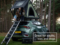 ALS TentBox LadderSteps. Family and dog sat in their TentBox Cargo 2.0 with the LadderSteps installed on the ladder and TentBox Chuck Box on the ground.