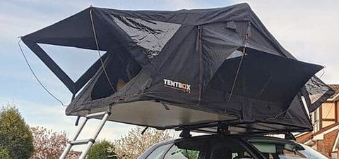 TentBox Lite installed on cross bars on small car